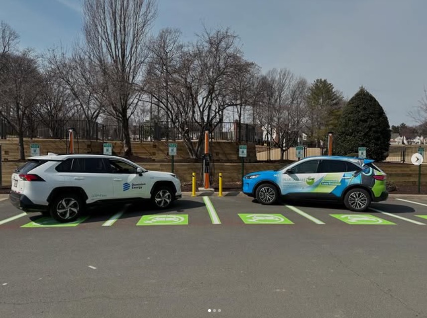 Electric vehicles charging at Penderbrook Golf Club — Blue Whale and Dominion Energy vehicles